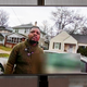 A TV display shows video evidence of a Grand Rapids police officer struggling with and shooting Patrick Lyoya at Grand Rapids City Hall on Wednesday, April 13, 2022.